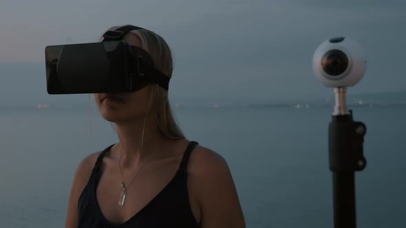 360 Degree Camera and Woman with VR Glasses