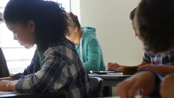 Students doing classwork in classroom