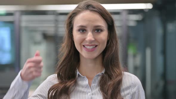 Portrait of Young Businesswoman showing Thumbs Up Sign