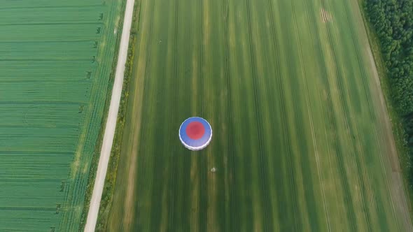 Hot Air Balloon in the Sky Over a Field
