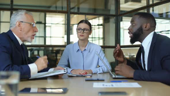 Female Manager Showing Stop Sign to Arguing Workers Office, Conflict Resolution