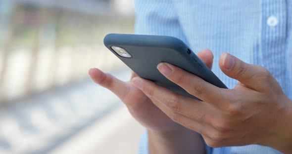 Woman use of smart phone at street