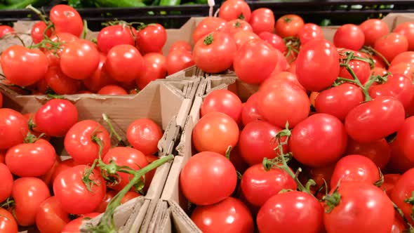 Red tomatoes in the supermarket, natural products grown on a farm in the village