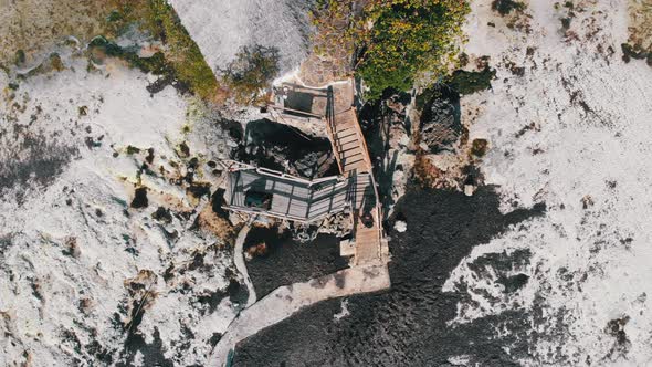 The Rock Restaurant in Ocean Built on Cliff at Low Tide on Zanzibar Aerial Top