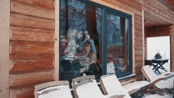 Women Best Friends Having Fun Winter Holidays in Wooden Mountain House