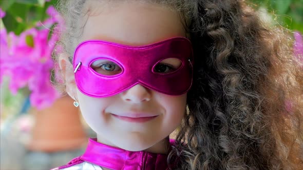 Beautiful Little Girl in the Superhero Costume, Close Up Portrait Child in the Mask of the Hero