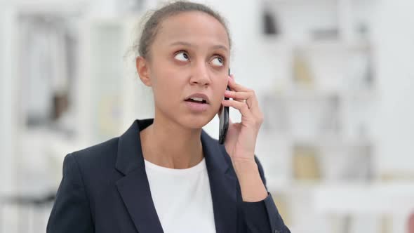 Portrait of Cheerful African Businesswoman Talking on Smartphone