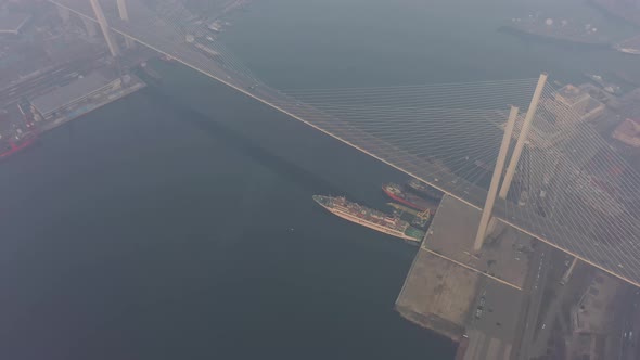 Drone View of the Golden Bridge and the City at Dawn in Heavy Smog