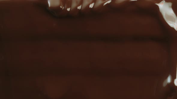 Closeup Macro Shot Hot Melted Liquid Chocolate Flows Flowing Molten Chocolate or Dark Caramel Stream