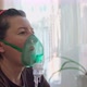 A European Woman at Home Carries Out Inhalation Inhalation of Oil Vapors Oxygen Through a Mask - VideoHive Item for Sale
