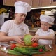 Mother with Her Son Prepare Vegetable Salad Together Cut Fresh Cabbage - VideoHive Item for Sale