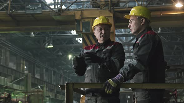 Plant Workers Having Conversation At Workplace