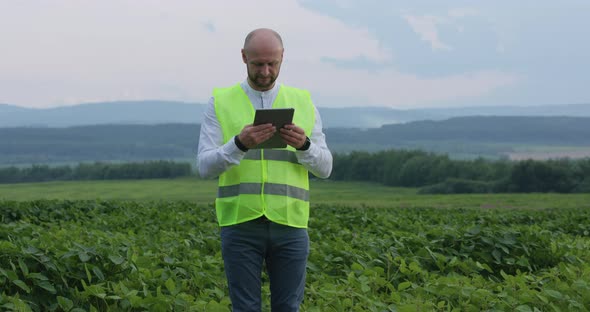 Professional Young Agronomist Uses Digital Technology To Improve Yields