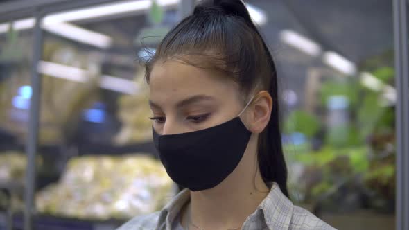 Woman in Protective Mask Walking in Supermarket