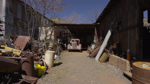 Abandoned car and rusty objects alt