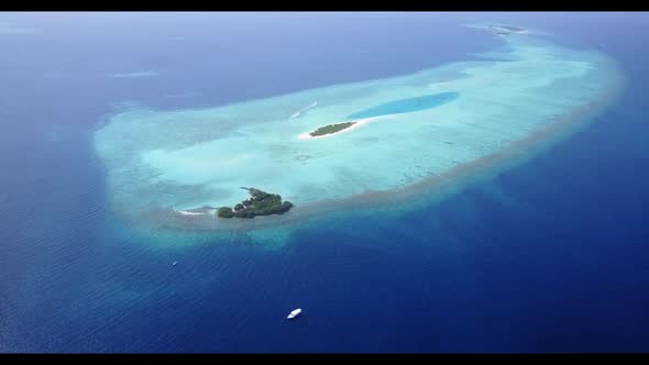 Aerial above scenery of idyllic resort beach journey by turquoise sea with white sand background of 