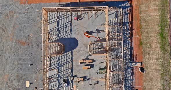 Aerial View of Elevator Shaft for Concrete Block Building Under Construction on Workers are Laying