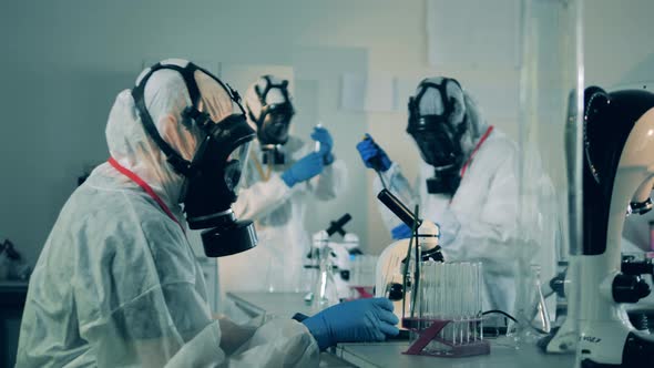 Many People in Hazmats Work in Laboratory, Researching Coronavirus Antibodies.