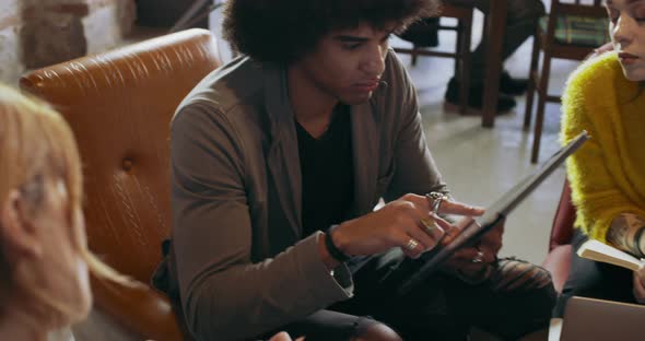 Man Showing Photos and Images on Tablet