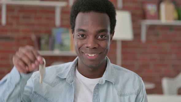 African Male Holding a Key