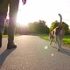 Man walk with cute dog at small lane in green city park, low camera follow - VideoHive Item for Sale