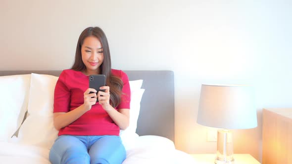 Young asian woman use smart phone