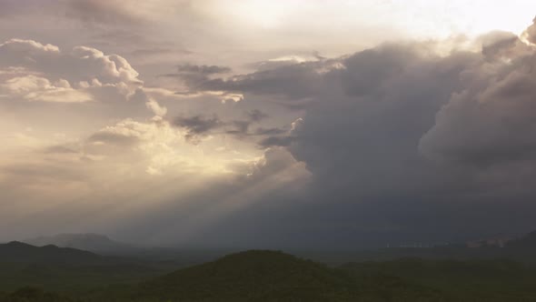 Rain storms and black clouds moving over the mountains.