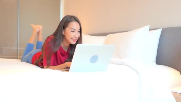 Young asian woman use laptop