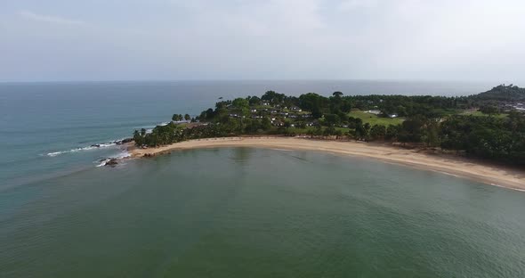 Aerial shot of the coastline and horizon of Mermaids Bay in the Southwest Africa San Pedro Ivory Coa