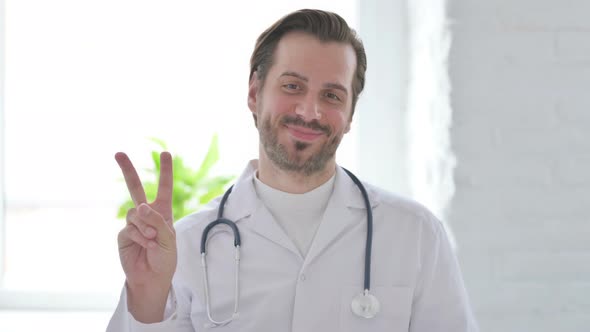 Portrait of Young Doctor Showing Ok Sign with Finger