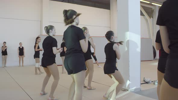 Teen Girls Practicing Cheerleading Routine