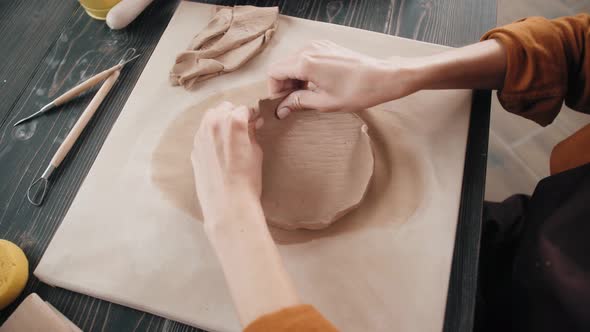 Beautiful Potter Master Woman Molds From Clay Pot in Master