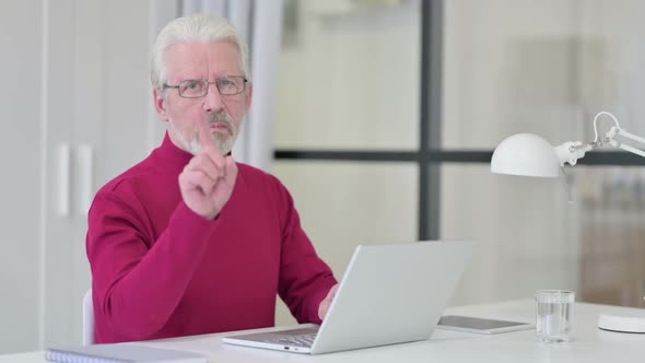 No Gesture with Finger By Old Man at Work