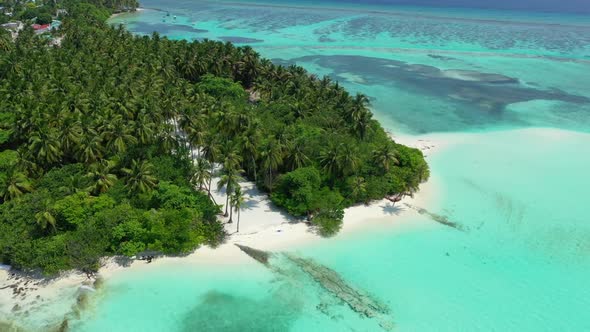 Aerial drone scenery of beautiful tourist beach journey by blue sea with white sand background of a 