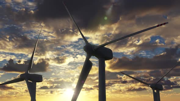 Wind Farm with with Turbines Against Sunset Skyline