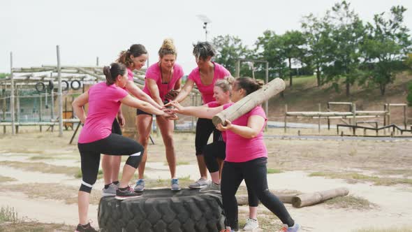 Female coach standing in front of women at bootcamp