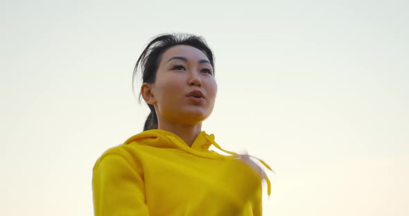 Young Woman Running In The Park