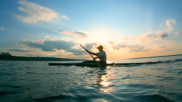 Male Paddler Is Rowing Towards the Shore
