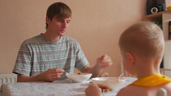 Father Eating Dinner With Son