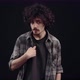 The Curly Charismatic Confused Young Man Looks at Him Grimaces and Says No No No I Don't - VideoHive Item for Sale