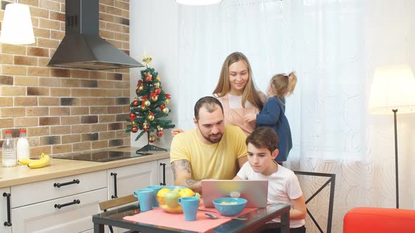 Friendly Family Together in Kitchen at Home