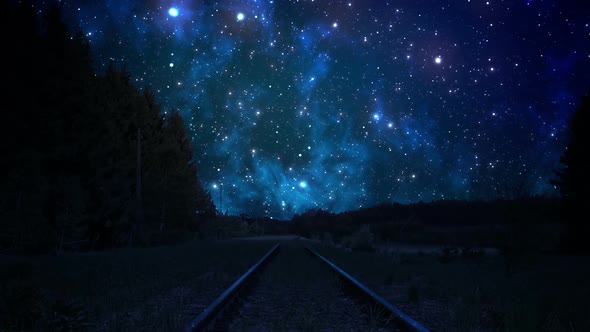 Inspiring animation of the night sky with fallingstars spread over railroad. HD