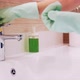 Woman's Gloved Hand Washes the Faucet in the Bathroom - VideoHive Item for Sale