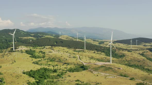 Aerial Footage of Windmills or Wind Farm in Mountains