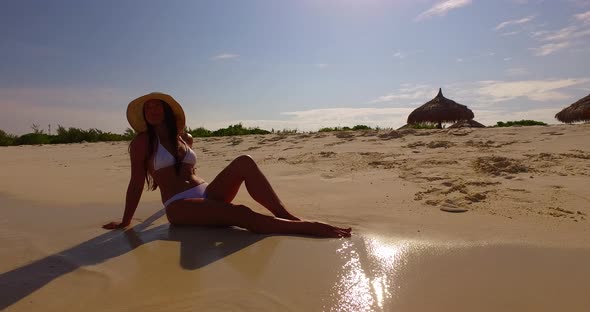 Young Smiling Girl Relaxing Having Fun on Beach on Paradise White Sand and Blue