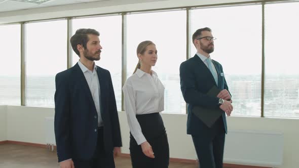 Business Meeting Team of Elegant Top Managers Walk to Business Meet the Interior of a White Office