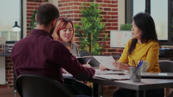 Diverse Team of People Clapping Hands to Celebrate Achievement