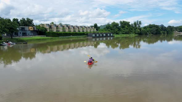 Couple Men and Women in Kayak on the River Kwai in Thailand