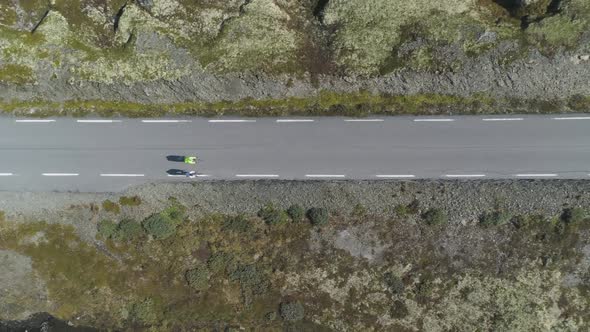 Cyclists in Helmets Are Racing on Mountain Road in Norway in Summer