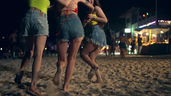 4K Group of Asian woman enjoy full moon beach party and dancing together.